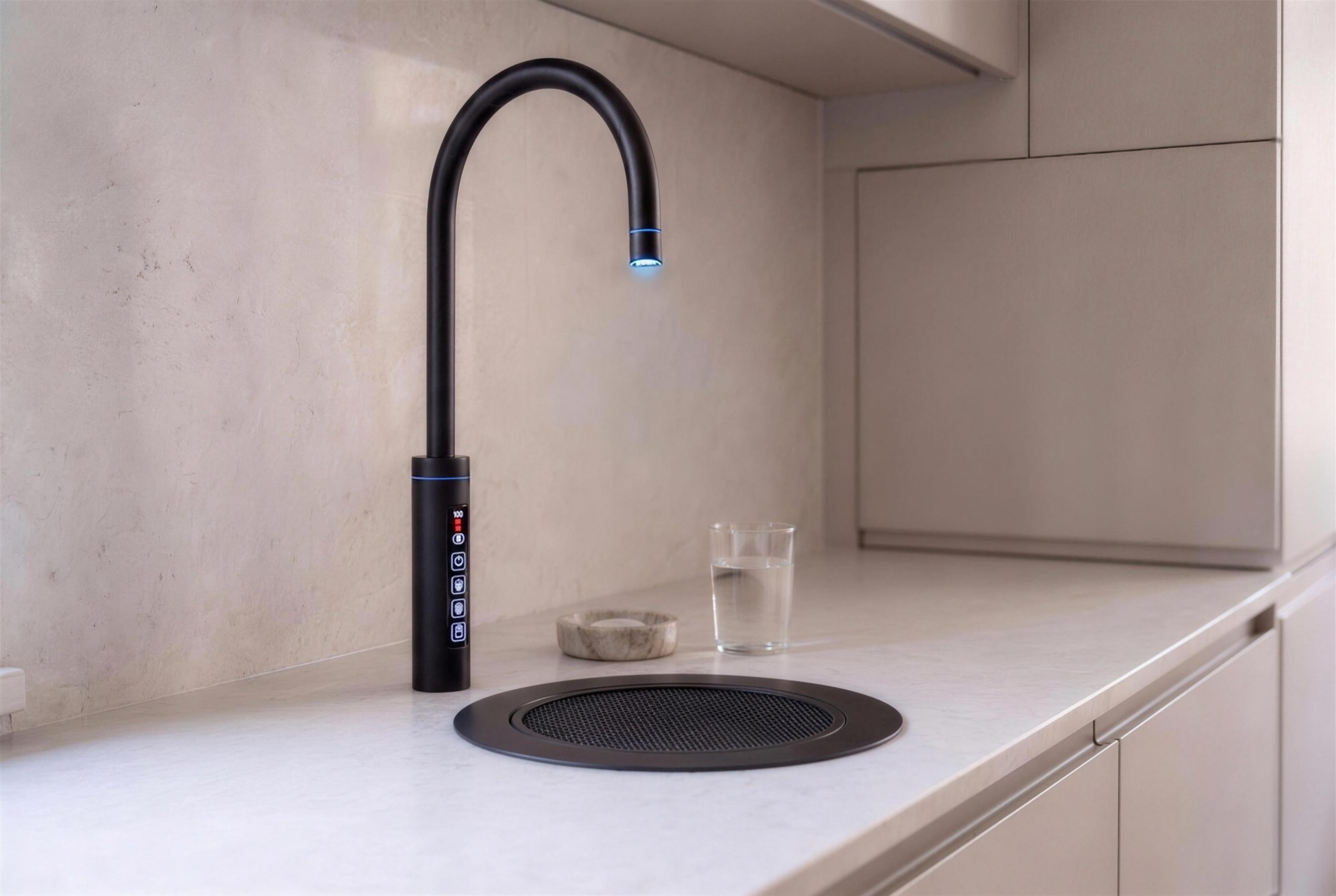 Matt black RoyalFlow touch tap with matt black drip tray on a pale stone worktop, chilled light glowing blue