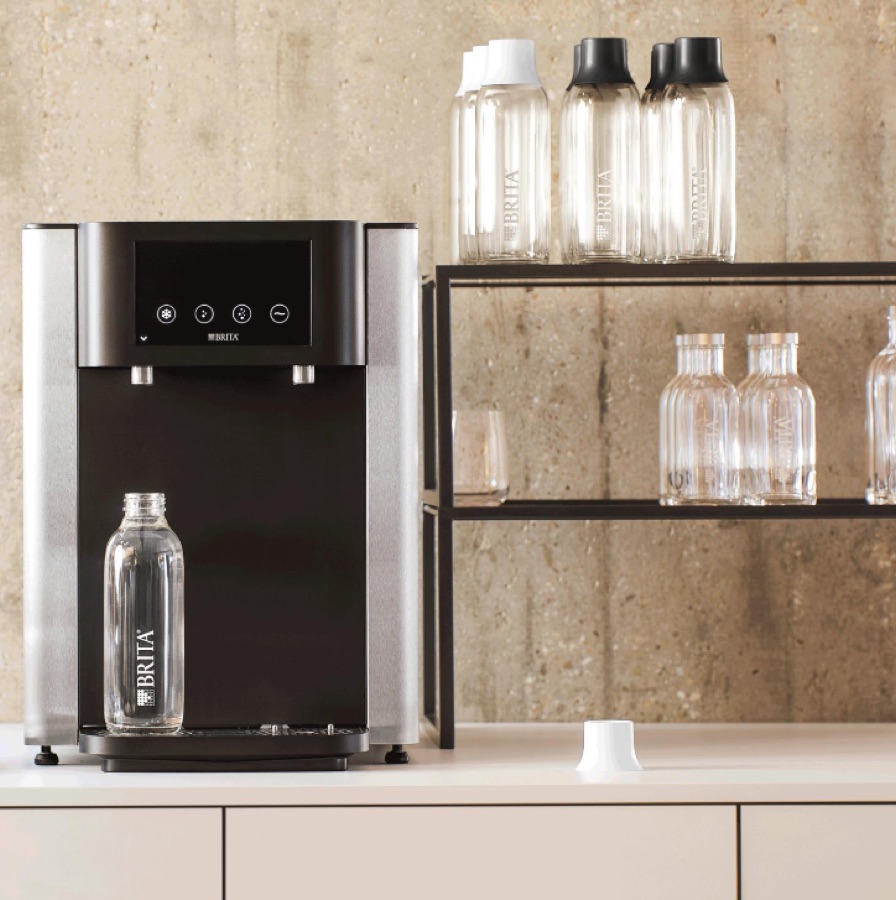 BRITA water dispenser on an office kitchen counter serving filtered drinking water