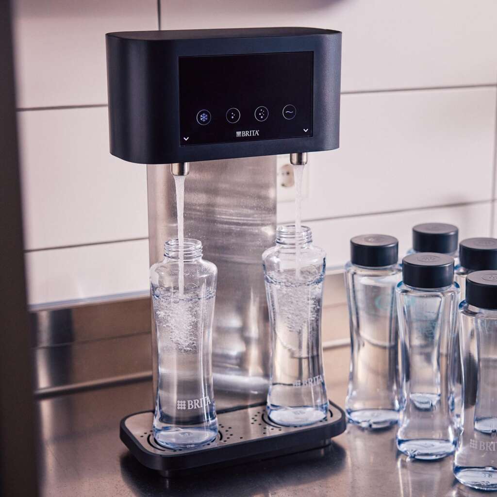 BRITA mains-fed water dispenser filling reusable glass bottles